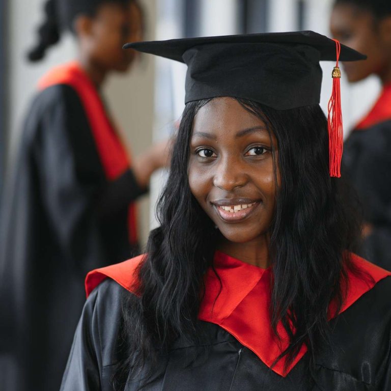 education, graduation and people concept - group of happy international students with diplomas